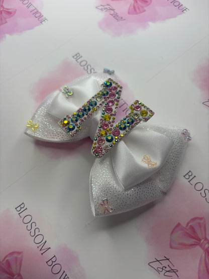 Twinkling initial and bows💕