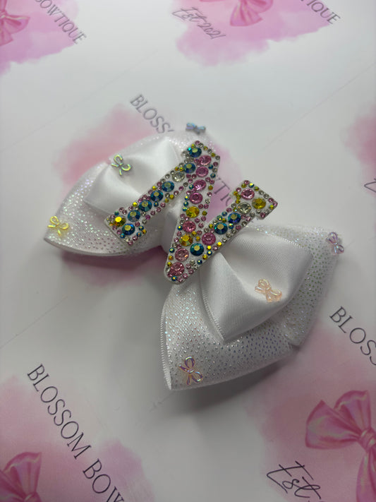 Twinkling initial and bows💕